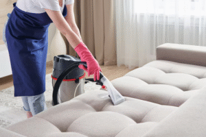 Person using Bissell Spot Clean on carpet stain in modern living room